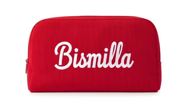 Red fabric toiletry bag with white cursive text Bismilla for travel and organization