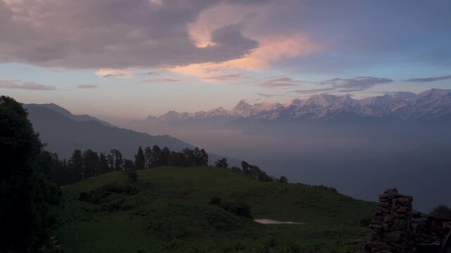 Dayara Bugyal Uttarakhand India. Bandarpoonch, Draupadi Ka Danda and other Gangotri Glacial Peaks. Snowy mountain peaks above layered blue hills
