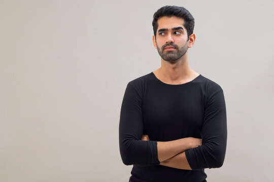 Portrait of a young man looking elsewhere with crossed eyes