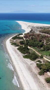 Vertical aerial view of Possidi sand cape and turquoise sea in Halkidiki Greece drone shot 9:16
