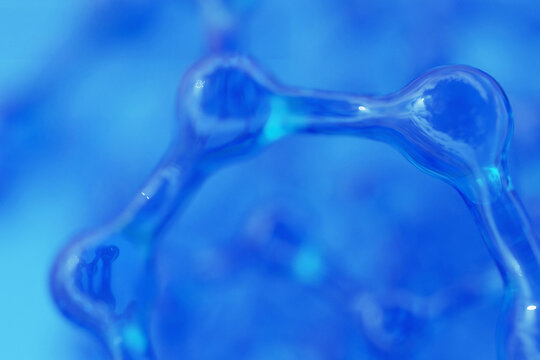 blue molecular structure with soft focus and shallow depth of field. Glassy scientific abstract background for medical, nanotechnology and biochemistry concepts. Water structure