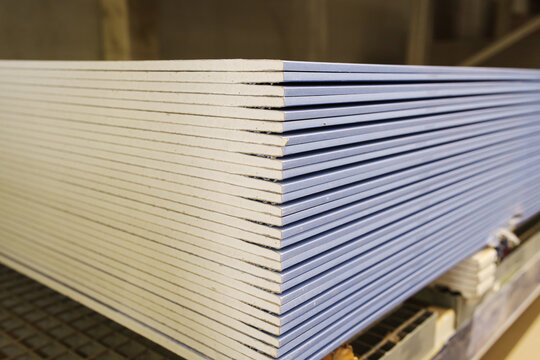 Stacked gypsum board sheets at a construction store