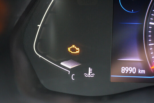 Check engine light in the coolant section of a new vehicle digital gauge cluster 