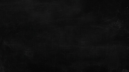 Fototapeta premium Scratched dark surface with textured marks and scratches on a uniform black background