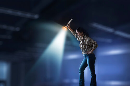 Young girl searching down with torch light