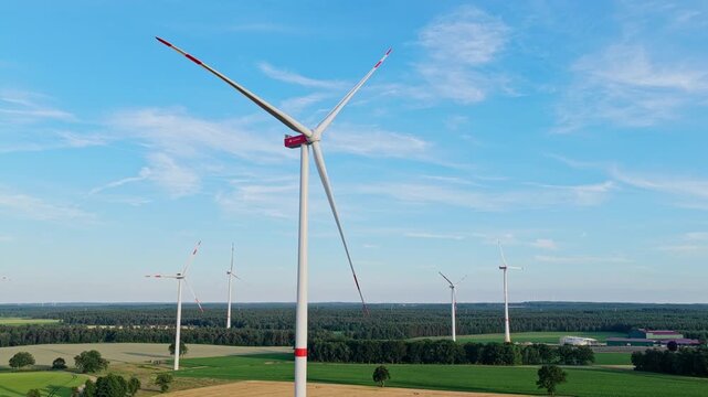 Green energy. Wind mill for renewable electric energy production. Wind mill for renewable electric energy production. Windmill in a rural area. Offshore wind park. Wind turbines farm