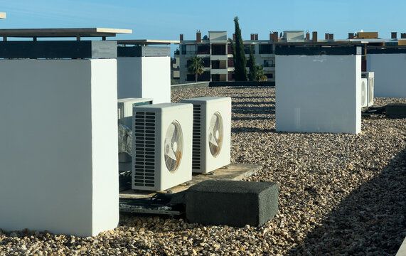 Air conditioning (HVAC) installed on the roof of industrial buildings. Stock Photo