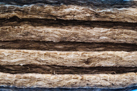 Stacked brown rockwool thermal slabs texture