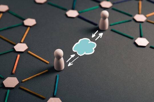 Cloud synchronization concept connecting people across distributed business networks