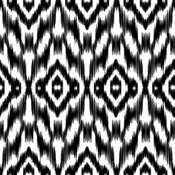 Black and white Ikat seamless pattern vector background. Traditional ethnic geometric diamond and chevron ornament for textile, fabric, wallpaper, wrapping and fashion design.
