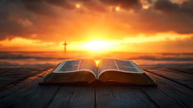A Bible on a wooden surface against the backdrop of the golden and orange rays of the setting sun cutting through the sky.
