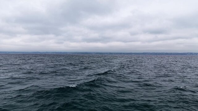 Drone tracking forward over Lake Geneva near Coppet, Switzerland