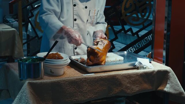 a chef carefully slicing succulent roasted duck with a professional kitchen knife, emphasizing the delicate technique required for the traditional preparation
