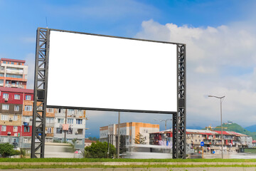 Fototapeta premium Mock up: blank white billboard or large display against moving car traffic, white clouds in the blue sky in Batumi. White screen, long exposure, mockup, template and copy space concept