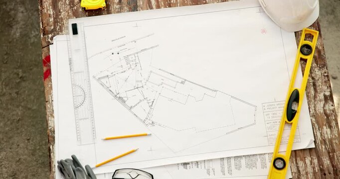 Blueprint, architecture and construction site with tool for floor plan on table for property design. Creative, civil engineering and document for renovation, remodeling and above sketch for precision