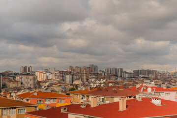 Obraz premium View of gray clouds in the cloudy sky over typical turkish apartment, residential buildings in Istanbul - afternoon, daylight. Architecture and cityscape concept