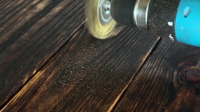 Close-Up of Wire Brushing Charred Pine Wood to Enhance Natural Grain