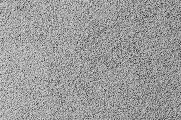 Fototapeta premium Concrete wall with rough white plaster layer. Front view, background photo texture 