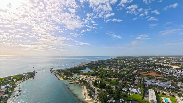 Coastal Gateway: High Aerial View of Jupiter Inlet, Rock Jetties, and Surrounding Beaches, Florida