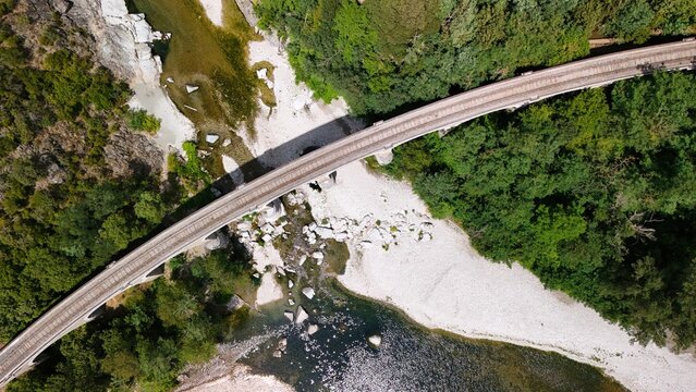 Aerial View of Historic Railway Bridge Crossing the Gardon River in Anduze, France