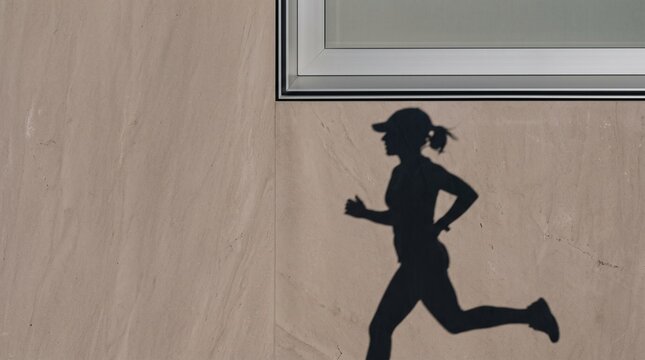 Female Runner Jogging Silhouette on Floor