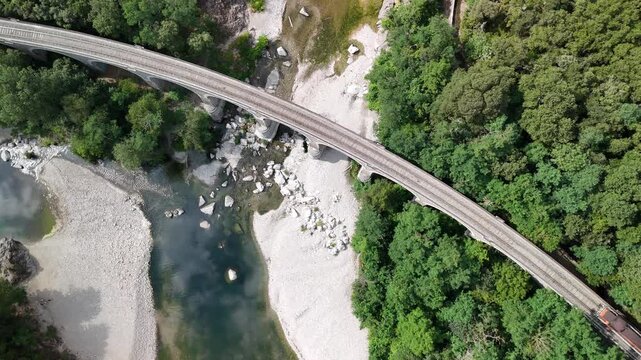 Aerial View of Historic Steam Train Crossing Stone Railway Viaduct near Anduze, France