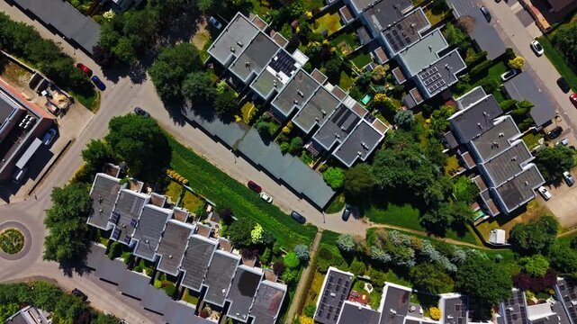 Suburban Housing Development Aerial View Real Estate Neighborhood Property Investment. High angle top down drone shot of a modern residential neighborhood district 
