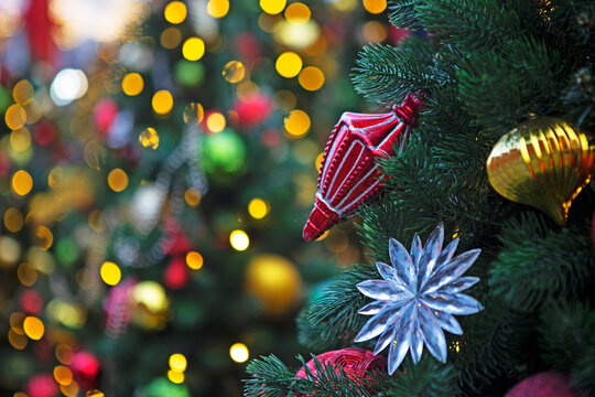 Christmas tree with decorations. Greeting card background. New Year's bokeh.Advertising background