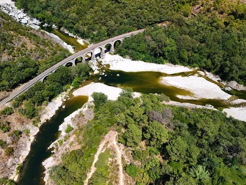 Aerial View of Historic Railway Bridge Crossing the Gardon River in Anduze, France