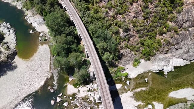 Aerial View of Historic Railway Bridge Crossing the Gardon River in Anduze, France