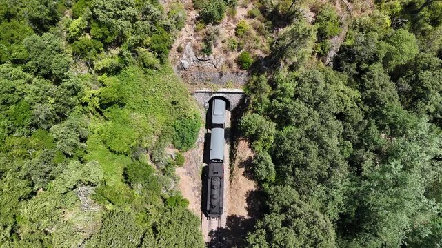 Aerial View of Historic Steam Train Crossing Stone Railway Viaduct near Anduze, France 