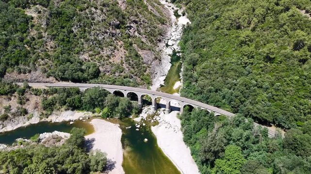 Aerial View of Historic Railway Bridge Crossing the Gardon River in Anduze, France