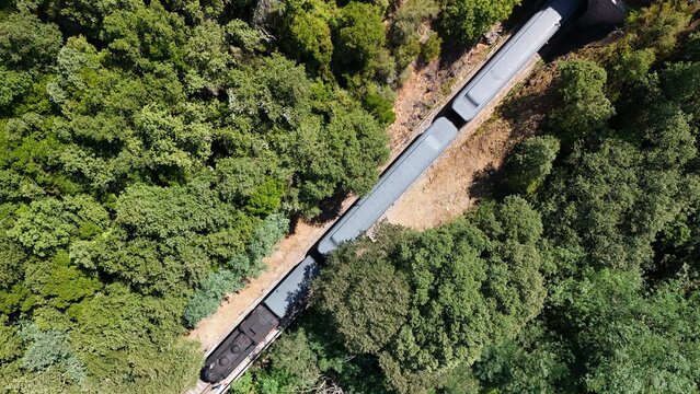 Aerial View of Historic Steam Train Through the C&eacute;vennes Forest near Anduze, France
