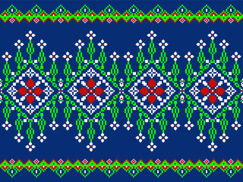 Seamless pixel textile pattern featuring diamond floral motifs, geometric borders, and symmetrical repeating layout in blue, green, red, and white tones for fabric and surface design.