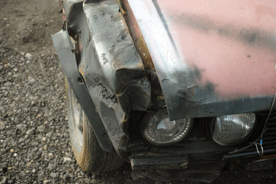 trashed poorly painted car