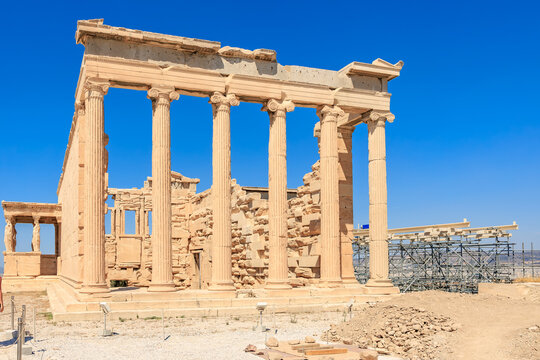 The building is a temple with columns and a large open courtyard, Acropolis in Athens