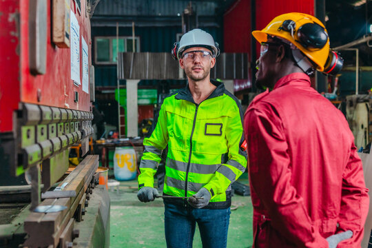 Supervisor Coaches Technician on Sheet Metal Folder Operation and Work Process