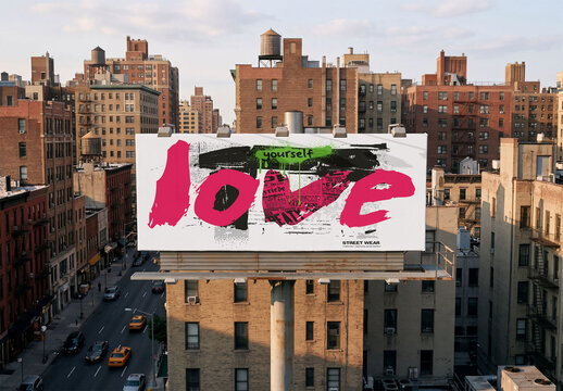 Mockup of A large blank billboard stands atop a building in New York City. 