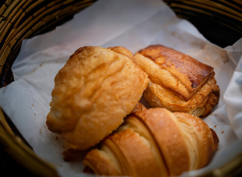 Three croissants in a bamboo basket, Paris, France