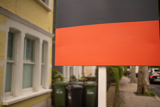 LONDON - blank estate agent sign board with copy space on residential street