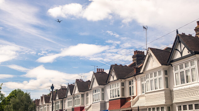 LONDON - row of terraced houses with large blue sky and copy space