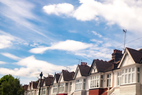 LONDON - row of terraced houses with large blue sky and copy space