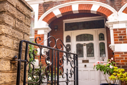 LONDON - traditional front door with stained glass and iron gate