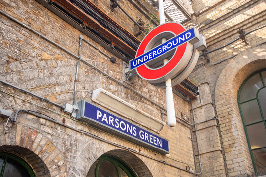 LONDON -  Parsons Green Underground Station &ndash; Classic roundel and station name sign on the brick wall.