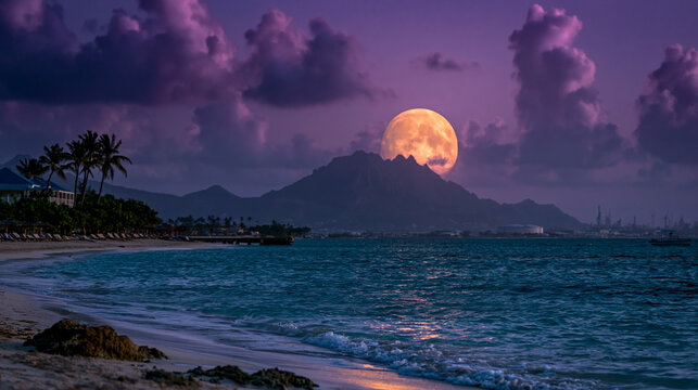Full moon rising over dark tropical beach with silhouette of palm trees and mountains, fullmoon
