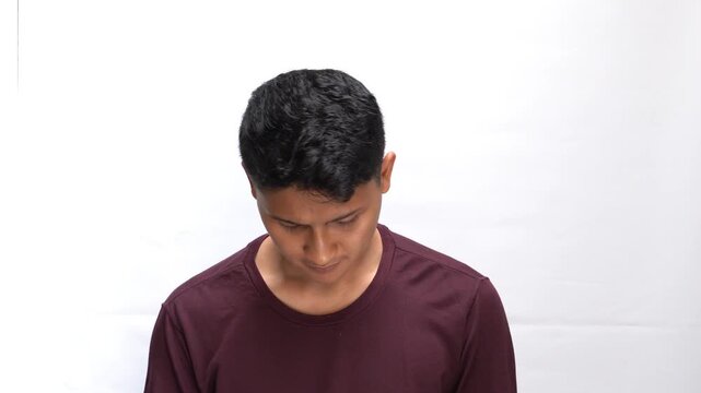 Confused Young Man in Red T-Shirt