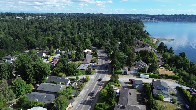 Coastal road arteries navigate transition between residential cliffside properties open water, serving Des Moines basin. This route shows regional reliance on transit paths thru Puget Sound, WA
