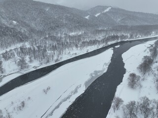 Partially Frozen Teshio River During a Snowstorm in Northern Hokkaido, Japan – Aerial Drone Footage  © Doggy Drone