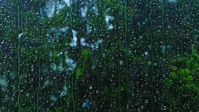 heavy rain falling on the window surface .stormy weather