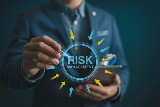 Businessman holding tablet with circular risk management dashboard and directional arrows.